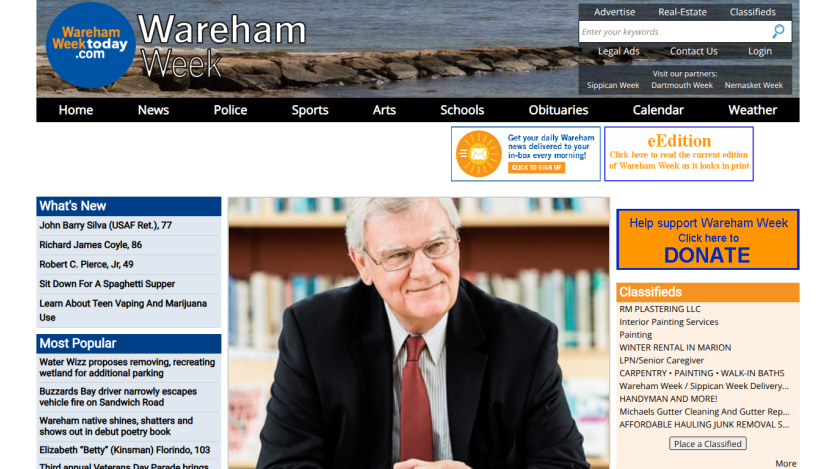 Local news website Wareham Week with navigation bar, news headlines, and a portrait of an elderly man in a suit and tie