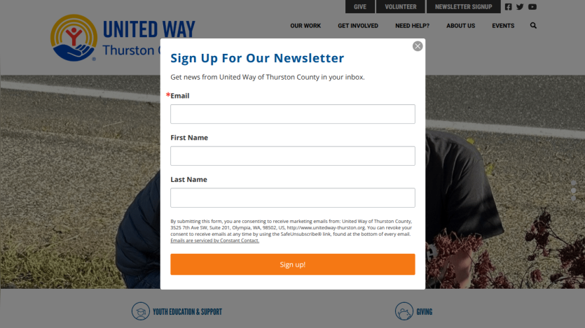 Homepage with navigation bar, large hero image of a mountain landscape, and headline 'Explore the World with Us'