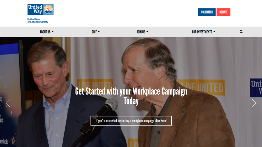 Homepage header with navigation menu and large hero image featuring a mountain landscape and welcome text