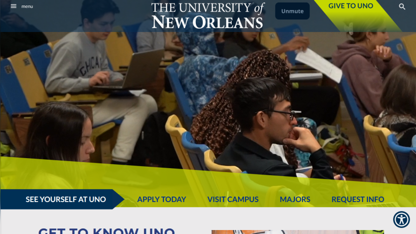 University of New Orleans homepage featuring students in a classroom setting and navigation options.