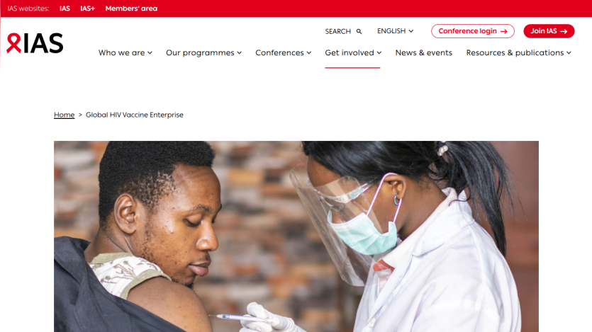 IAS website showing a healthcare professional administering a vaccine to a patient.