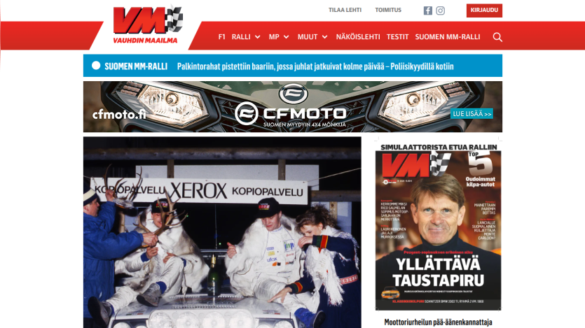 Vauhdin Maailma motorsport news site with navigation bar, banner ad, and magazine cover featuring racing content