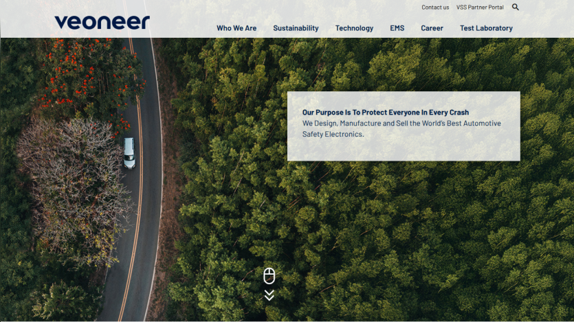 Veoneer homepage with navigation and a forest aerial view highlighting automotive safety electronics purpose