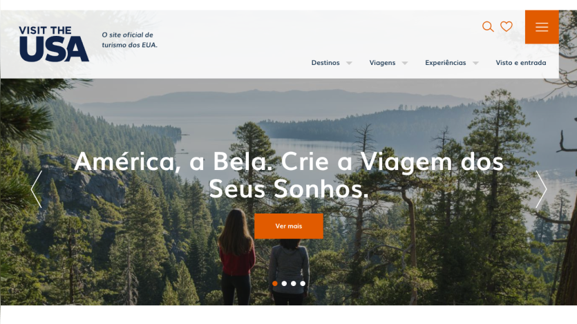 Official USA tourism site in Portuguese featuring a scenic forest and lake with headline inviting to create dream trips