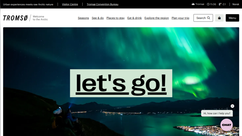 Tromsø tourism site with navigation links and a hero image of northern lights and 'let's go!' text