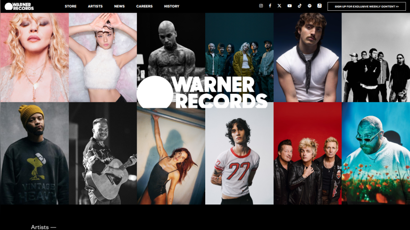 Warner Records homepage with artist photos grid and navigation menu including Store, Artists, News, Careers, History