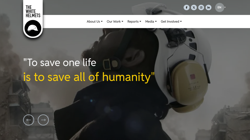 The White Helmets website with a slogan about saving lives and humanity, featuring a person in a helmet against a backdrop of smoke and rubble.