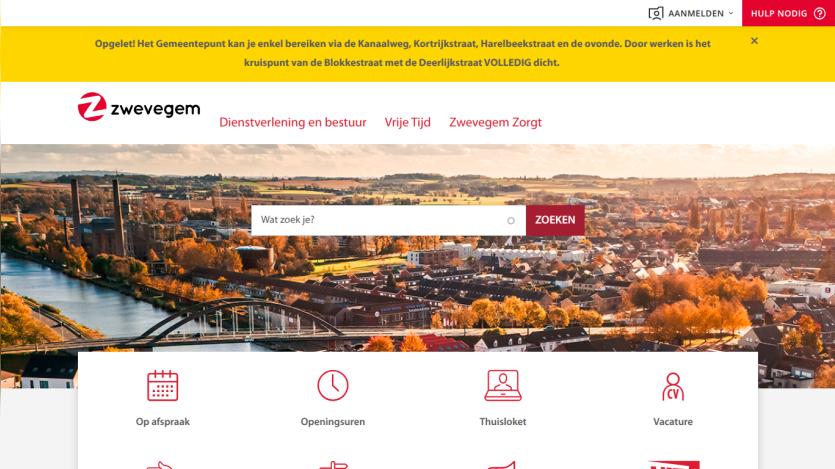 Zwevegem municipal website with navigation links, search bar, and autumn cityscape background