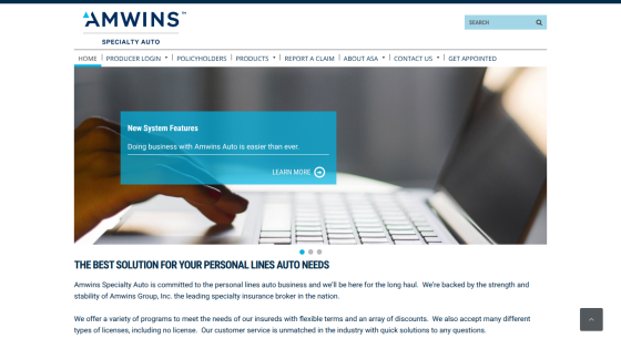 Amwins Specialty Auto homepage with navigation menu, search bar, and hero section promoting new system features for easier business