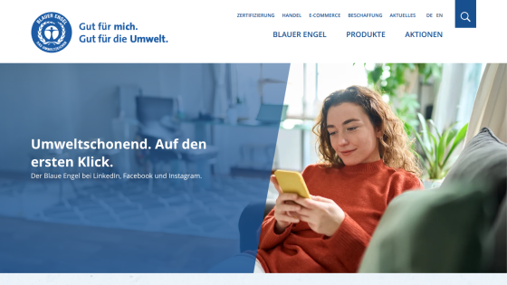 Website promoting environmental awareness with a woman using a smartphone.