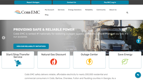 Coco EMC homepage showcasing services and outage information with a utility truck image.