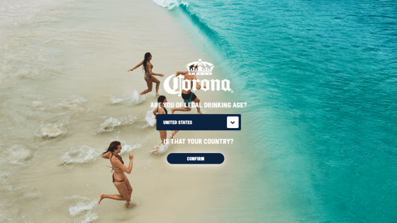 Corona website with beach background and prompt to select country for drinking age verification