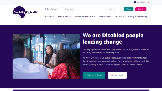 Homepage of Disability Rights UK featuring a group discussion and mission statement.
