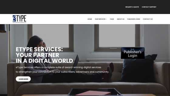 eType Services homepage with headline about digital services and a woman using a laptop on a sofa