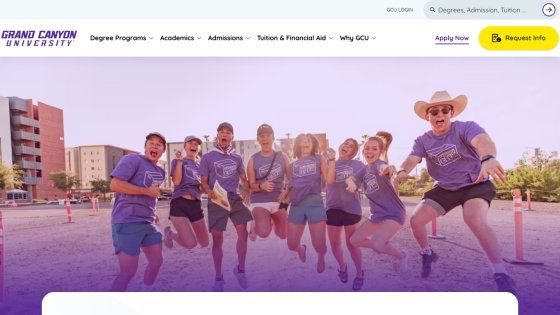 Students in purple shirts jumping together on campus, promoting Grand Canyon University.