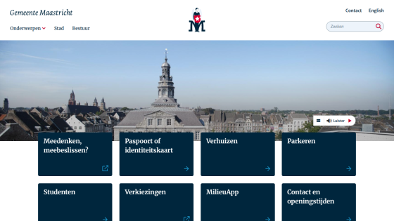 University website homepage with navigation menu and a cityscape hero image under a clear sky