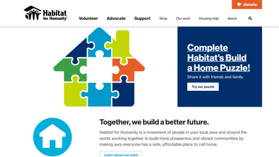 Habitat for Humanity homepage featuring a colorful puzzle graphic and a call to action for building a home puzzle.