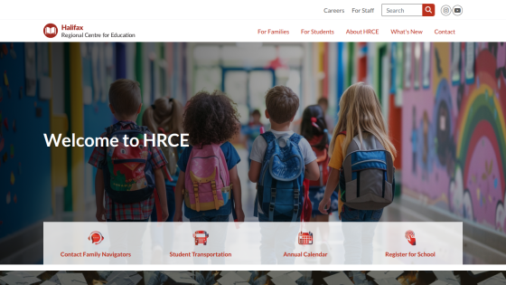 Homepage of HRCE with children walking in a colorful hallway and welcome message.