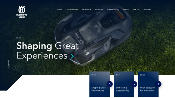 Homepage featuring a robotic lawn mower with the text 'Shaping Great Experiences'.