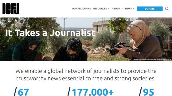Homepage with navigation bar, large hero image of a mountain landscape, headline 'Explore the World', and a call-to-action button.