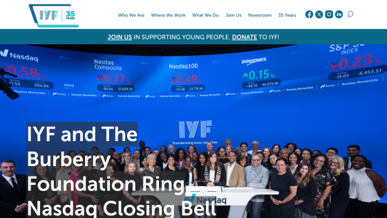 Homepage with navigation bar, large hero image showing a woman in a yellow jacket, and headline about a new collection