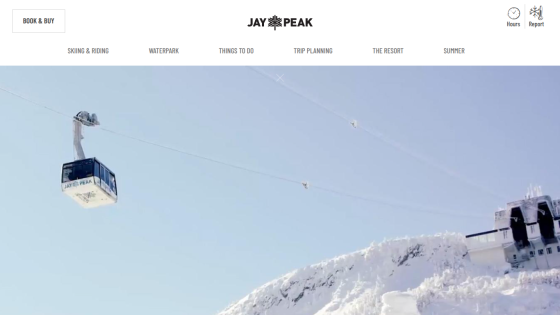 Jay Peak ski resort homepage with navigation and a skier in deep snow