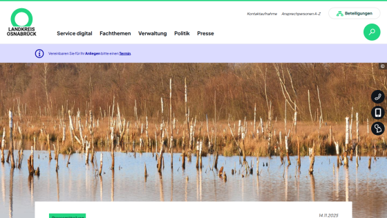 County Osnabrück website with navigation menu and a nature scene of a wetland with tree trunks in water