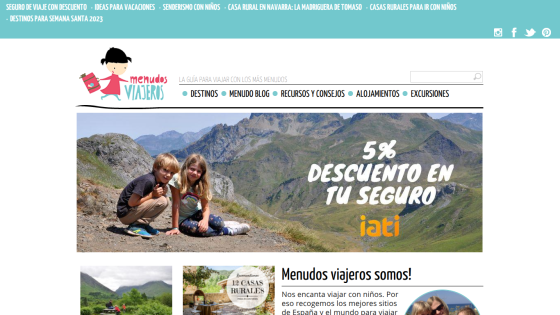 Homepage featuring a discount offer and travel-related images with children in a mountainous setting.