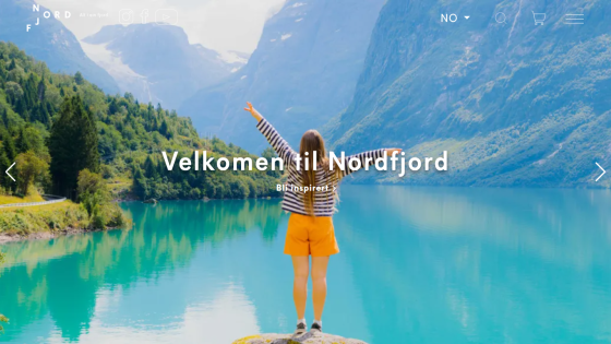 Travel website welcoming visitors to Nordfjord with a scenic fjord and mountains background