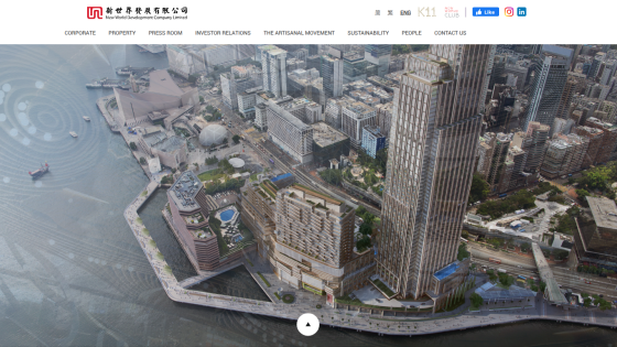 New World Development Company Limited website with navigation menu and aerial view of waterfront cityscape and buildings