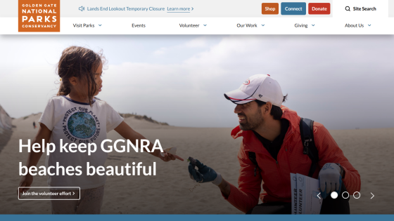 Homepage promoting beach conservation efforts with a child and adult on a beach.
