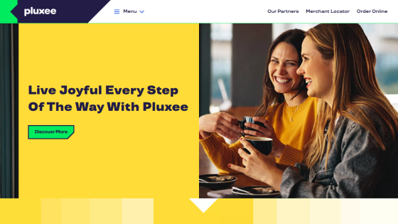 Pluxee homepage with tagline 'Live Joyful Every Step Of The Way With Pluxee' and smiling women enjoying coffee