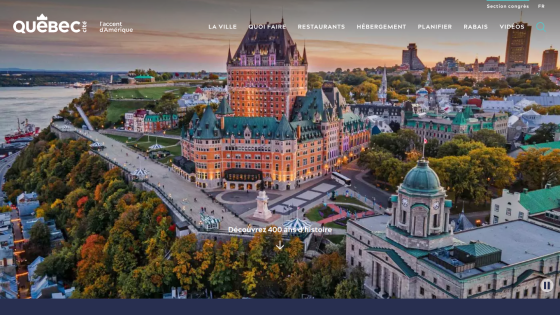 A scenic view of Quebec City featuring the Château Frontenac and surrounding landscape.