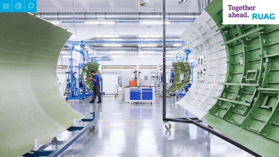 RUAG aerospace manufacturing facility with workers assembling aircraft components