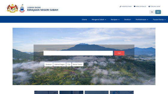 Homepage of the Sabah government website featuring a search bar and scenic mountain background.