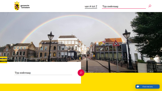 Municipality of Schiedam website with search bar and rainbow over city street in hero image
