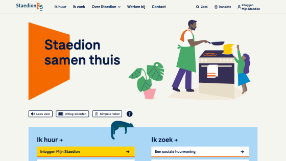 Staedion website homepage with navigation, slogan 'Staedion samen thuis', and illustration of a man cooking with a child