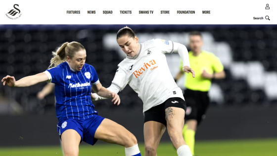 Swansea City AFC website header with navigation and hero image of two female soccer players competing for the ball