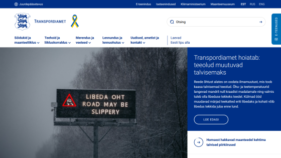 Transport agency website warning about changing road conditions to winter, with a slippery road sign and safety message