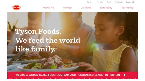 Tyson Foods homepage featuring a child and food with the tagline about feeding the world like family.