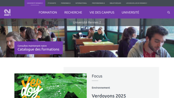 University homepage with navigation bar, banner promoting course catalog, and students in classroom