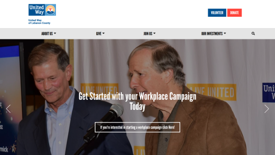 Homepage header with navigation menu and large hero image featuring a mountain landscape and welcome text