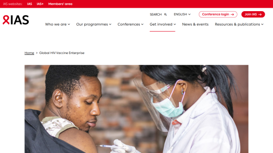 IAS website showing a healthcare professional administering a vaccine to a patient.