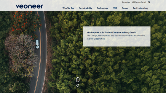 Veoneer homepage with navigation and a forest aerial view highlighting automotive safety electronics purpose
