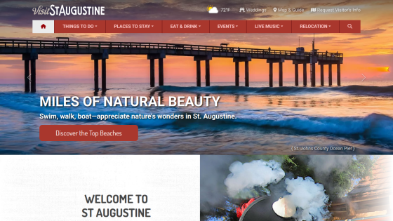 Homepage of Visit St. Augustine showcasing a pier at sunset with the text 'Miles of Natural Beauty.'