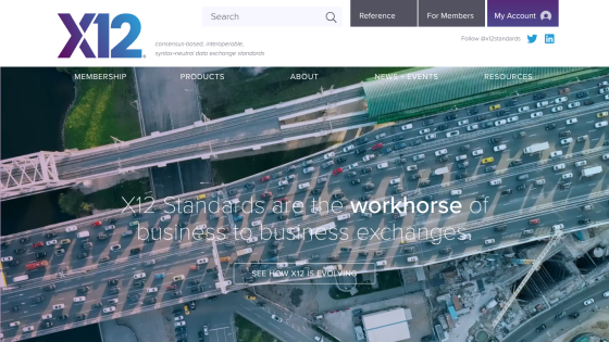 X12 website with navigation, search, and hero text about business-to-business exchange standards over a traffic aerial image