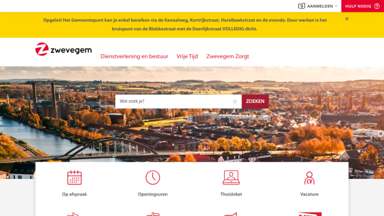 Zwevegem municipal website with navigation links, search bar, and autumn cityscape background