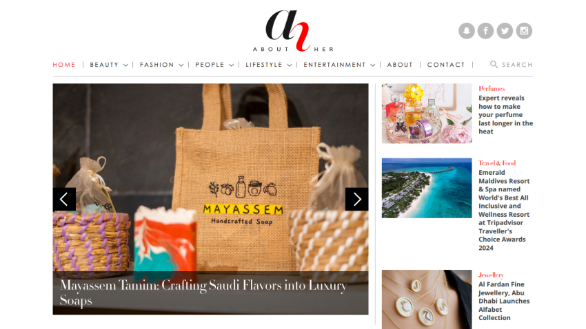 Lifestyle website homepage featuring a navigation bar and a hero image showcasing a Mayasseh branded bag with artisan crafts.
