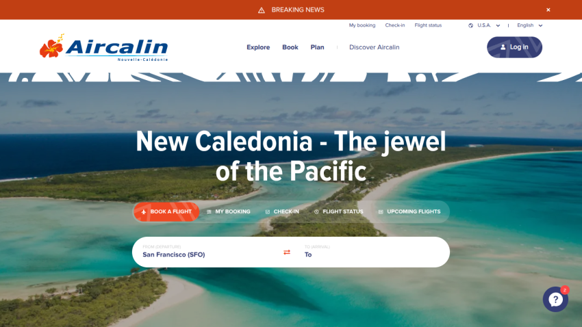 Aircalin homepage with tropical island background, headline promoting New Caledonia, and flight booking options