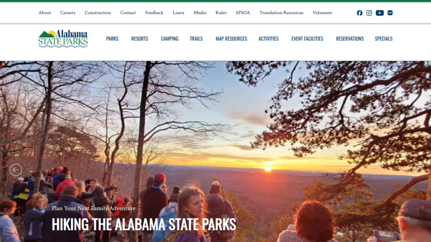 Promotional banner for hiking in Alabama State Parks with scenic sunset view.